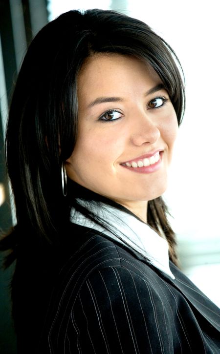 business woman portrait smiling in an office