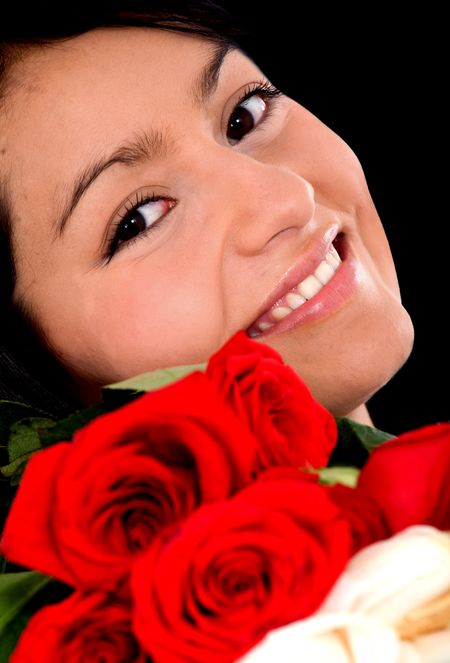 beautiful girl with roses by her face
