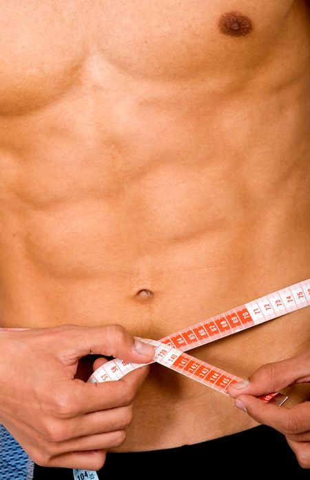 slim man measuring himself - lose weight series
