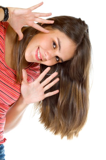 Happy woman framing her face with her hands  isolated over white