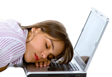 Business woman sleeping over a laptop computer - isolated over a white background