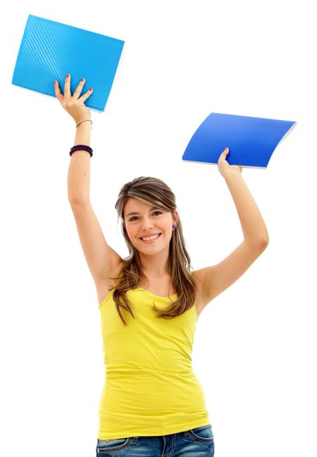 Happy female student holding notebooks - isolated over a white background
