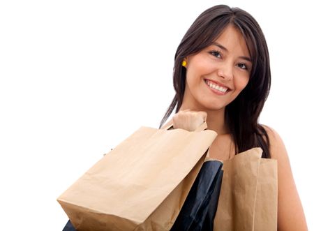 Beautiful shopping woman smiling isolated over a white background