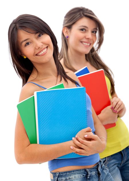 Beautiful female students with notebooks - isolated over white