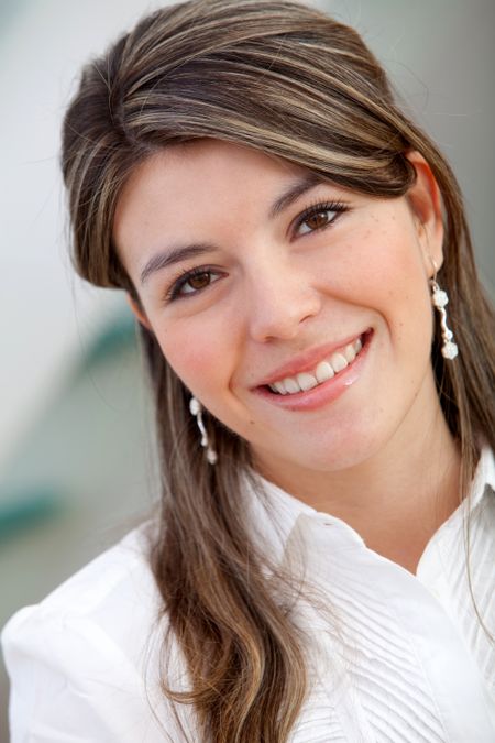 young-business-woman-smiling-office-50217976 Young business woman smiling at the office