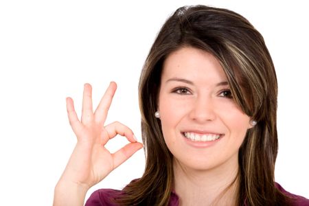 girl doing okay sign and smiling over a white background