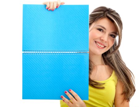 Girl holding a notebook isolated over a hwite background