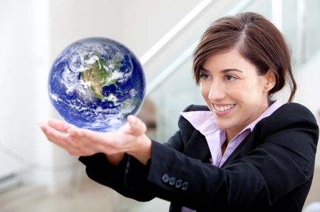 Business woman holding globe isolated over a white background