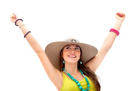 Happy summery girl with arms up and wearing a hat