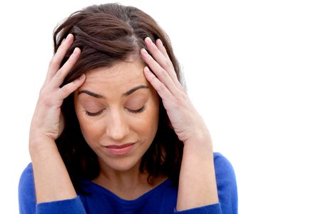 Concerned woman holding her head isolated over a white background