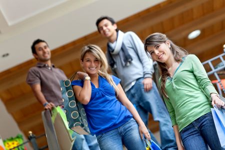 Group of people at a shopping center smiling