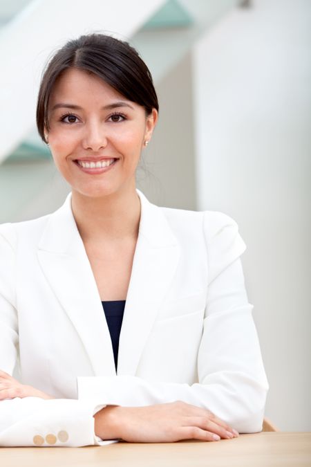 Beautiful business woman at the office smiling