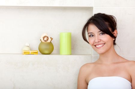 Beauty portrait of a female smiling at a bathroom