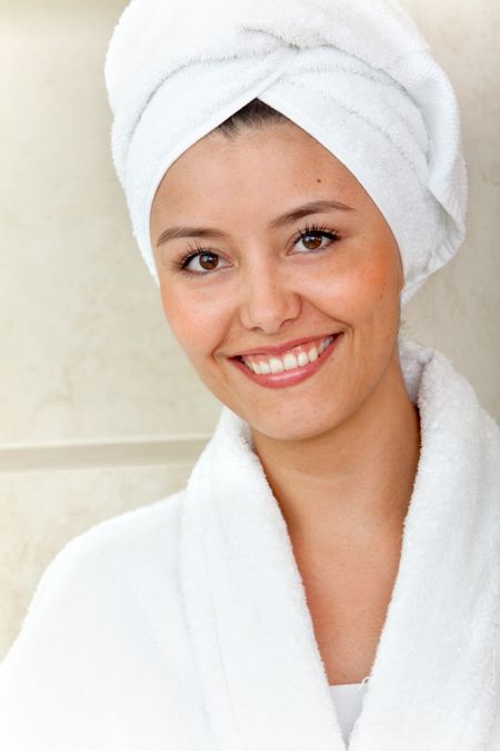 Beauty female portrait with a towel on her head