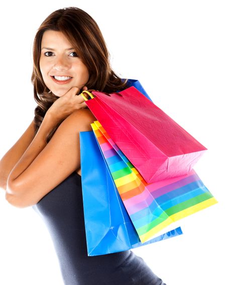 Woman holding shopping bags isolated over a white background