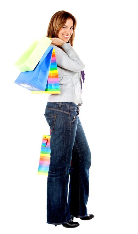 Woman standing with shopping bags isolated over a white background
