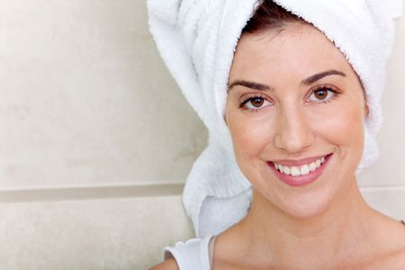 Beauty portrait of a woman with a towel on her head