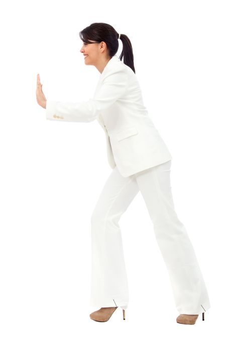 business woman pushing something isolated over a white background