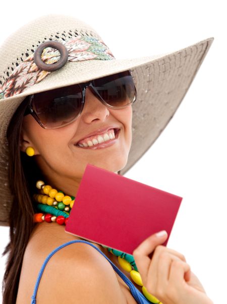 Beautiful summer woman smiling and showing her passport over a white background