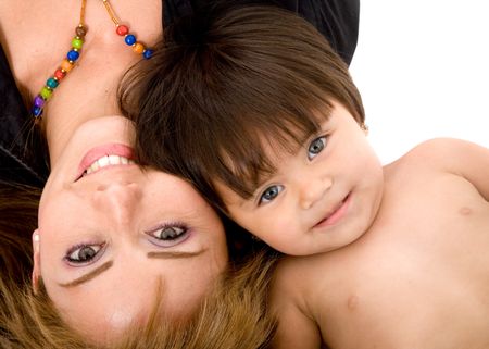 baby and her mum portrait on the floor where both are smiling