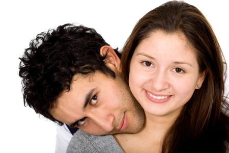 beautiful and cute couple portrait where both are smiling over a white background