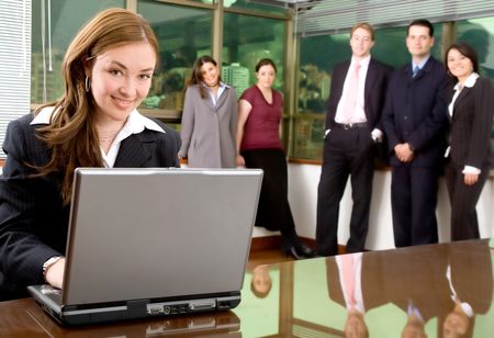Business woman and her team in an office