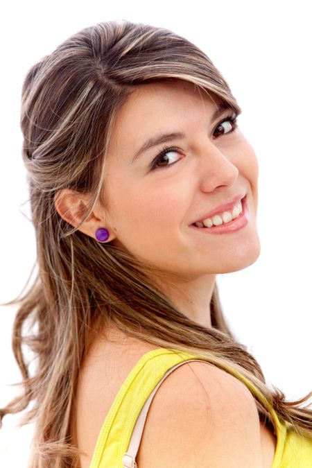 Beautiful young woman smiling isolated over a white background