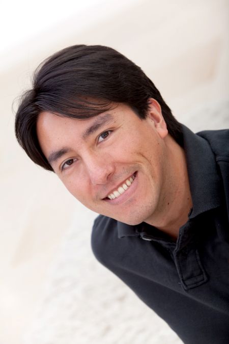 Portrait of a casual handsome man at home smiling