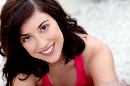 portrait-beautiful-casual-woman-sitting-home-50854228 Portrait of a beautiful casual woman sitting at home and smiling