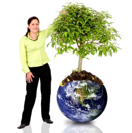 woman next to a tree growing from the earth over a white background