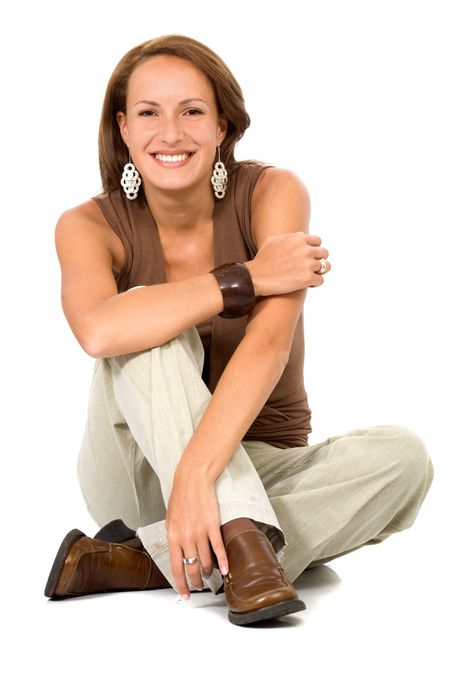 Casual woman portrait on the floor over a white background