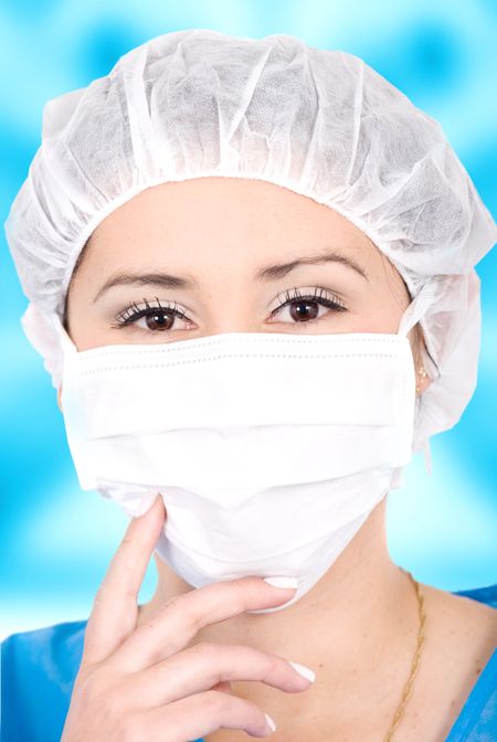 beautiful female portrait of a surgeon or nurse in blue