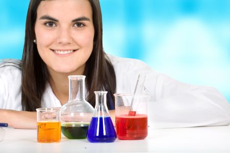female with chemistry objects in a laboratory