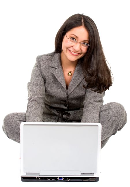 business woman on a laptop on the floor over a white background