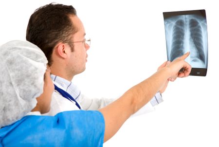 doctors checking a chest xray over a white background