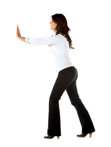 Business woman pushing something isolated over a white background