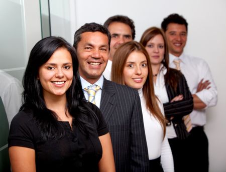 Group of business people at the office smiling