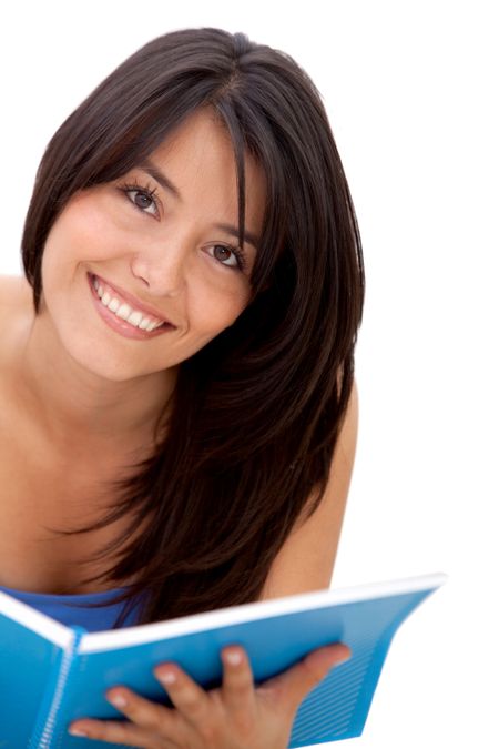 Beautiful female student with a notebook isolated over a white background