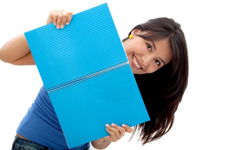 Fun female student smiling with a notebook - isolated over a white background