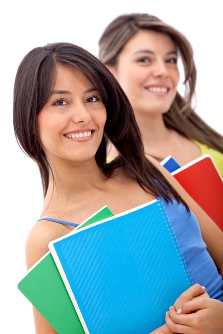 Beautiful female students with notebooks isolated over a white background