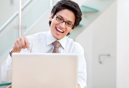 Successful business man on the computer at the office