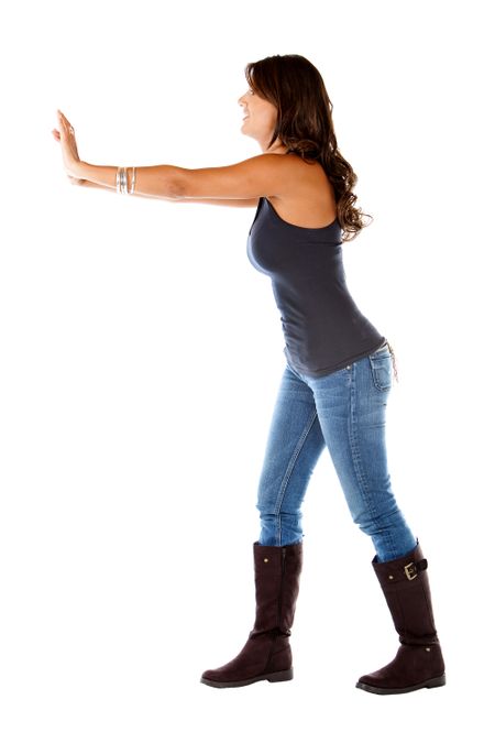 Woman pushing an imaginary object isolated over a white background