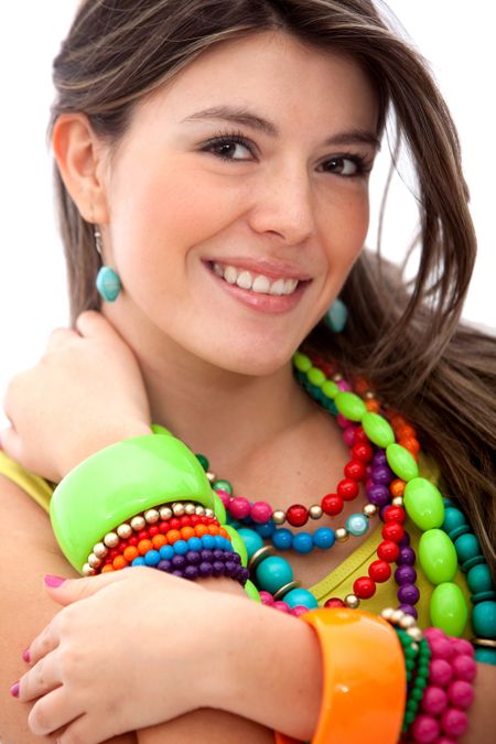 Woman with colorful jewelry smiling - isolated over a white background