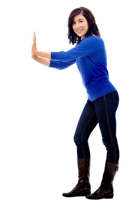 Woman pushing an imaginary object isolated over a white background