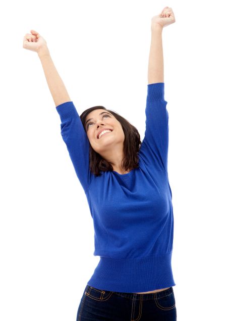 Happy woman with arms up isolated over a white background