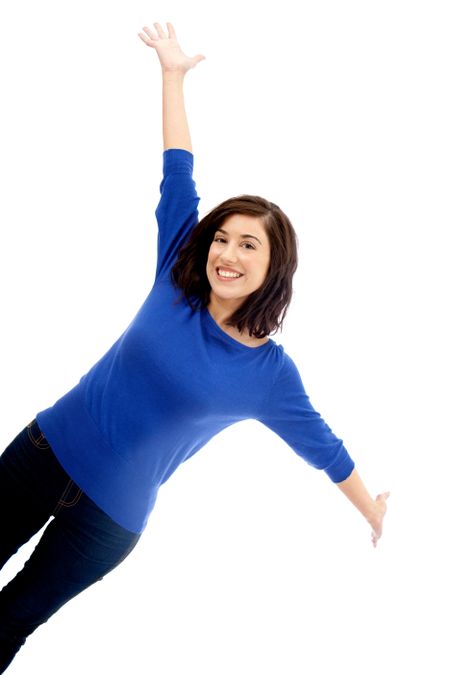Happy woman with arms up isolated over a white background
