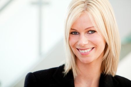 Beautiful business woman portrait at the office smiling