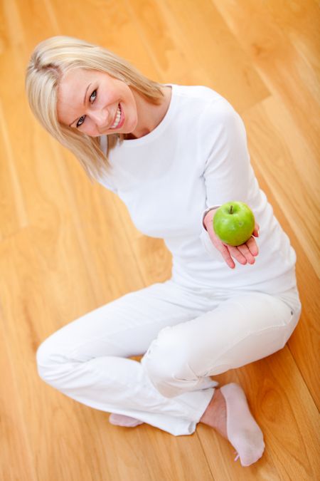 Healthy eating woman holding a green apple