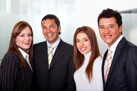 Small group of business people smiling at the office
