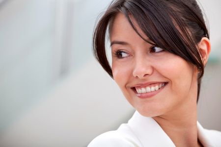 Friendly business woman portrait - smiling in her office